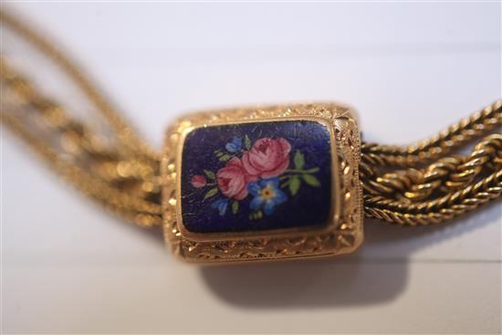 An early 20th century gold triple strand Albertina ropetwist chain, with floral enamelled plaques, gross 38.8 grams.